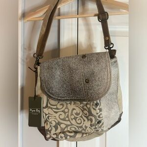 Brand new tags on Myra bag. Never used great condition. Fur like detail